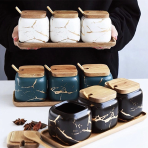 Spice jars with wooden tray and spoon